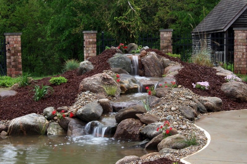 pool converted to pond with stream and waterfall in Wakarusa Indiana